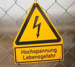 German high voltage danger sign - machine translation might be useful here! (Photo by Markus Spiske on Unsplash)